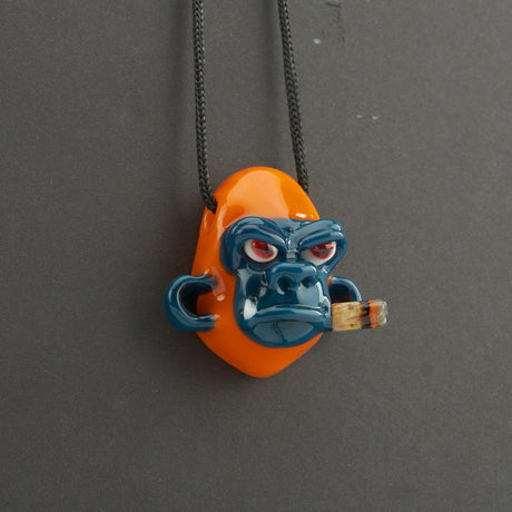 "Smoking Chimp Pendant - Orange/Peacock" By John Fischbach 2