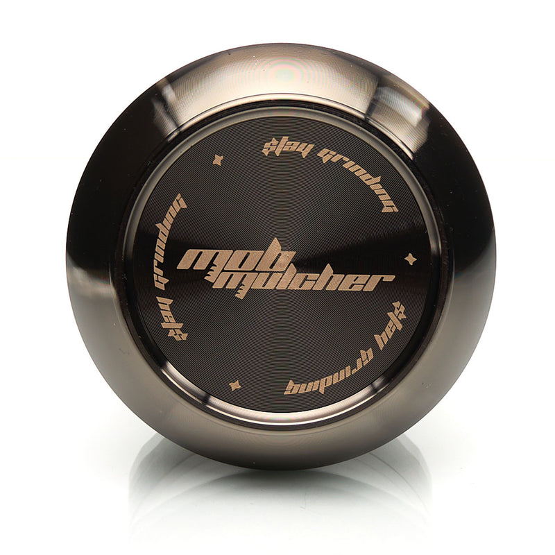MOB Mulcher UFO 4-piece herb grinder with stainless steel screen and scraper. Comes in black, rose, black and rose gold, and rose gold and black