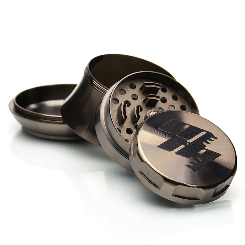 MOB Mulcher UFO 4-piece herb grinder with stainless steel screen and scraper. Comes in black, rose, black and rose gold, and rose gold and black