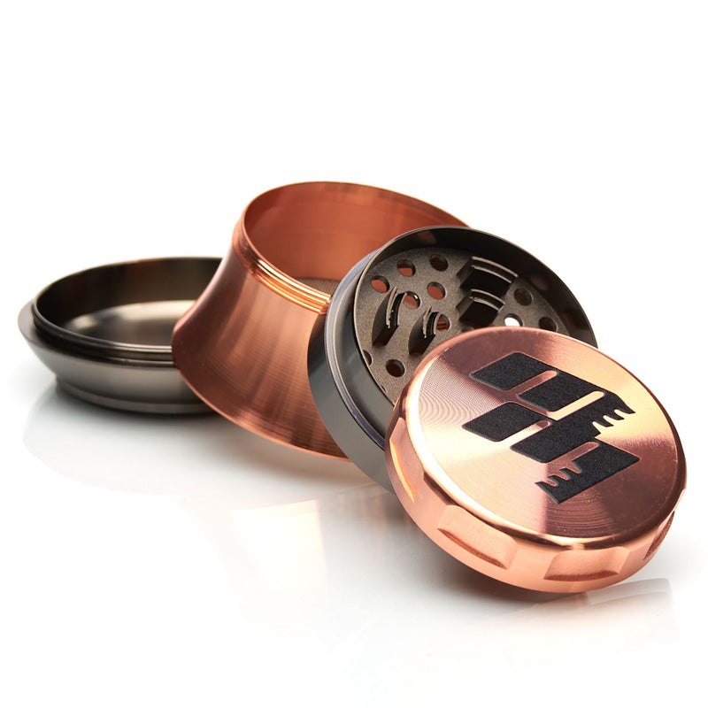 MOB Mulcher UFO 4-piece herb grinder with stainless steel screen and scraper. Comes in black, rose, black and rose gold, and rose gold and black
