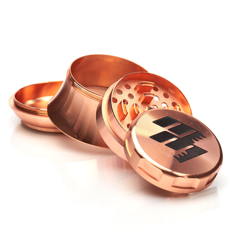MOB Mulcher UFO 4-piece herb grinder with stainless steel screen and scraper. Comes in black, rose, black and rose gold, and rose gold and black
